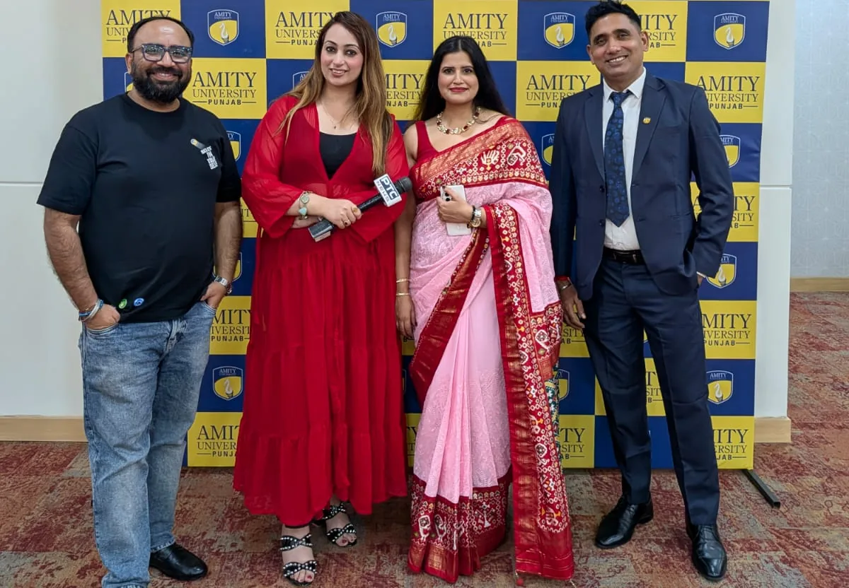 Gitish Chopra with the Amity University Punjab team and radio partners at the Orientation 2026 media wall